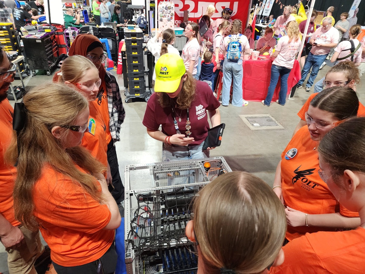 Students gathered around a VOLT robot